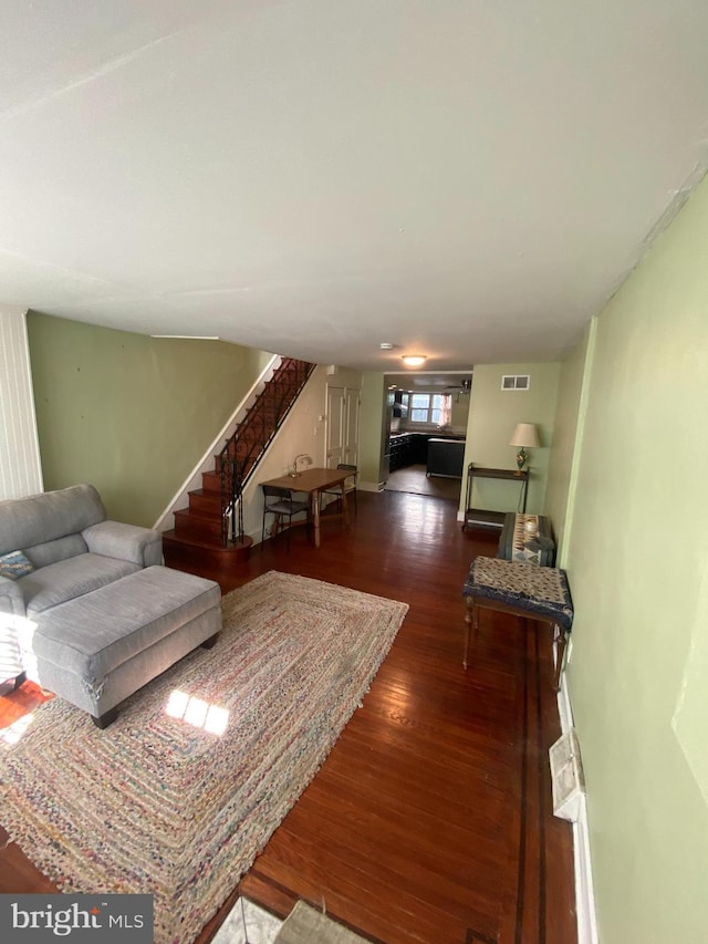 living room with dark hardwood / wood-style floors