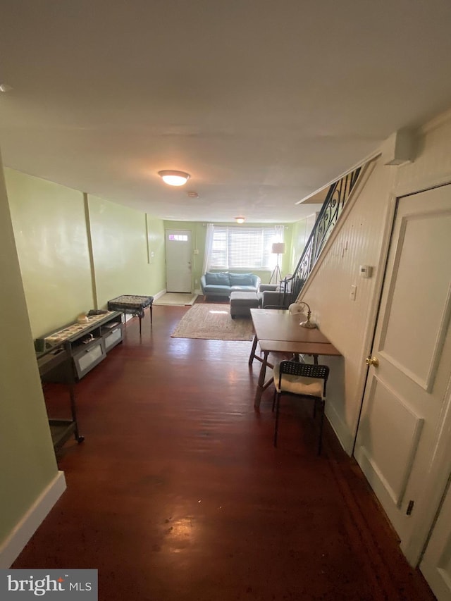 corridor featuring dark hardwood / wood-style floors