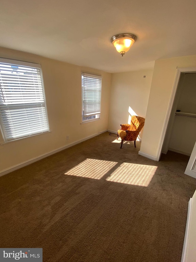 interior space with dark colored carpet