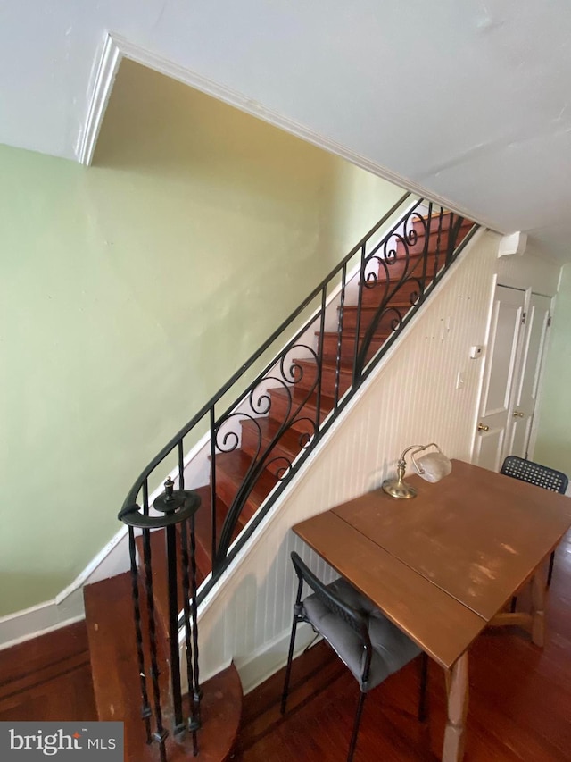 stairway featuring hardwood / wood-style flooring