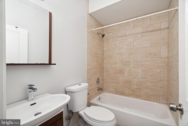 full bathroom with vanity, toilet, and tiled shower / bath