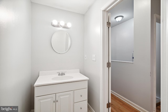 bathroom featuring vanity and hardwood / wood-style flooring