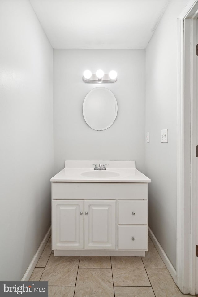 bathroom with vanity and tile patterned flooring