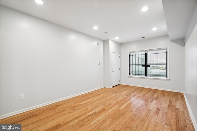 unfurnished room with light hardwood / wood-style flooring