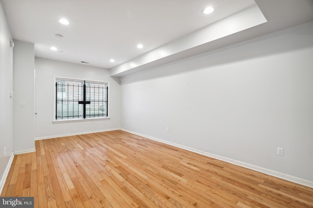 unfurnished room featuring light hardwood / wood-style floors