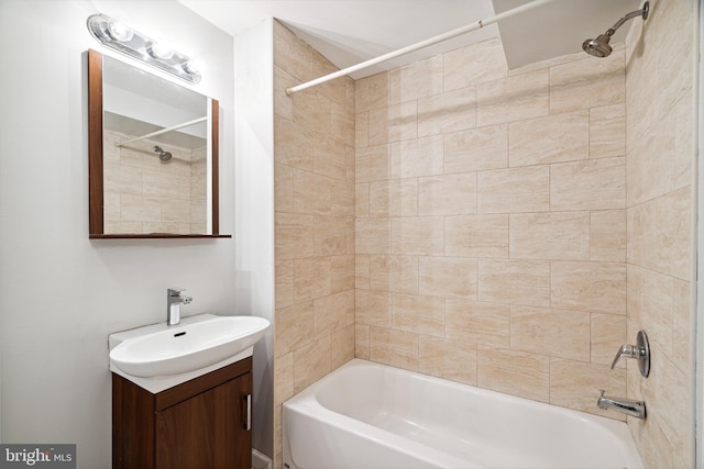 bathroom featuring vanity and tiled shower / bath combo