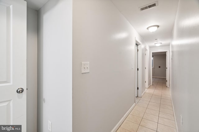 hallway featuring light tile patterned flooring