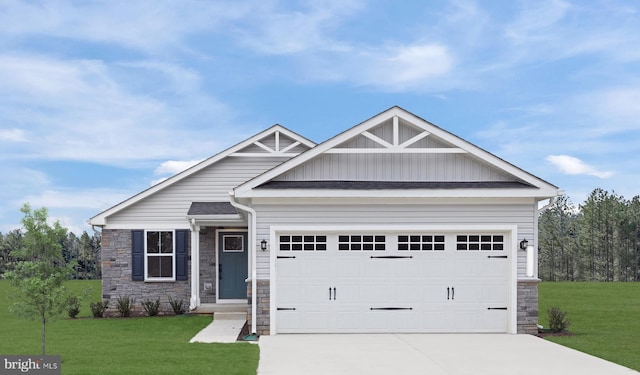 craftsman-style house with a front yard and a garage