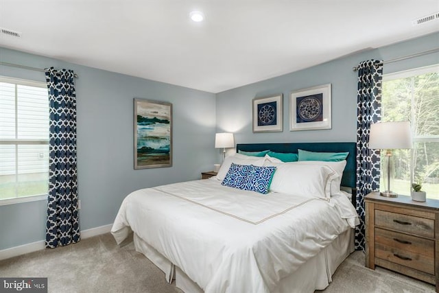 bedroom featuring light colored carpet