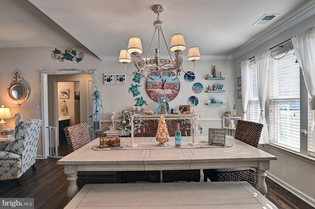 dining area featuring a chandelier, crown molding, and dark hardwood / wood-style flooring