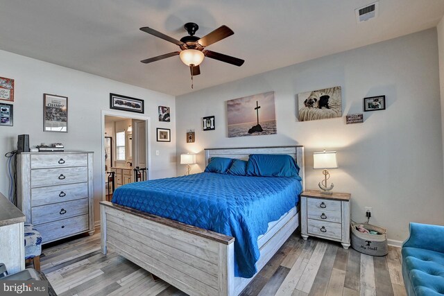 bedroom featuring wood-type flooring and ceiling fan