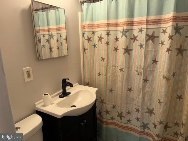 bathroom with vanity and toilet