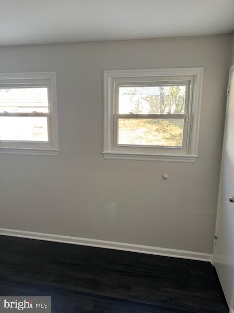 empty room with hardwood / wood-style floors