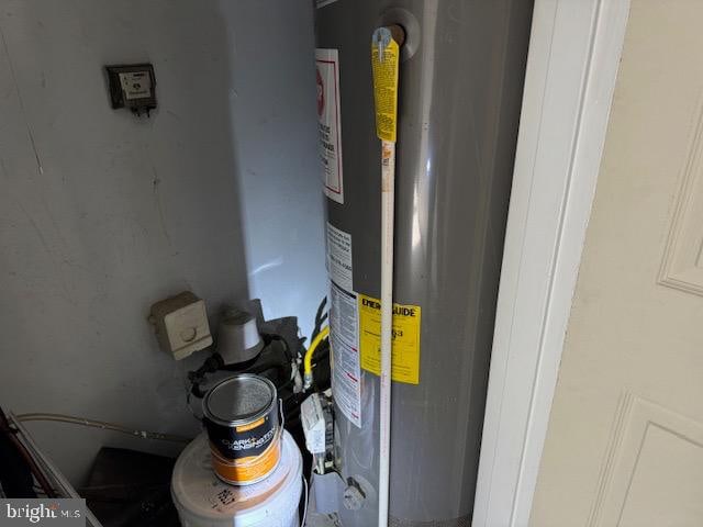 utility room with gas water heater