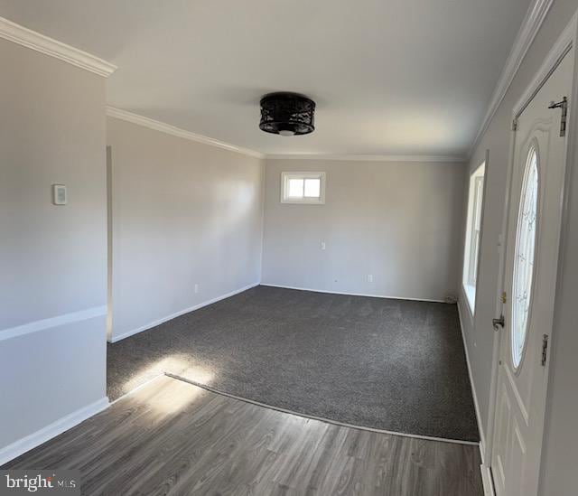 interior space with crown molding and dark hardwood / wood-style flooring