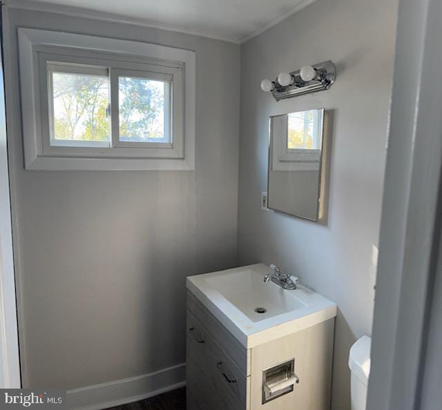 bathroom featuring vanity and toilet