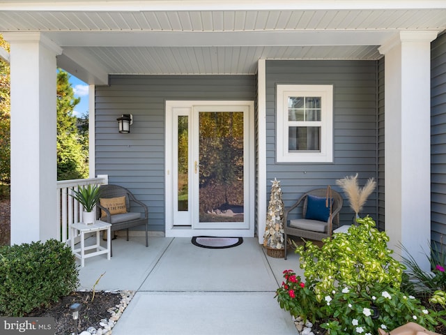 property entrance featuring covered porch