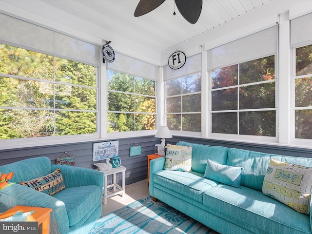 sunroom / solarium with ceiling fan and wooden ceiling