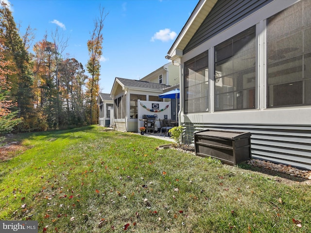 view of yard with a sunroom