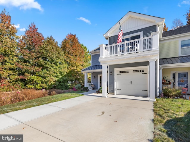 view of front of home with a balcony and a garage