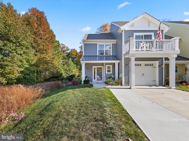 view of front of house featuring a porch, a front yard, and a garage