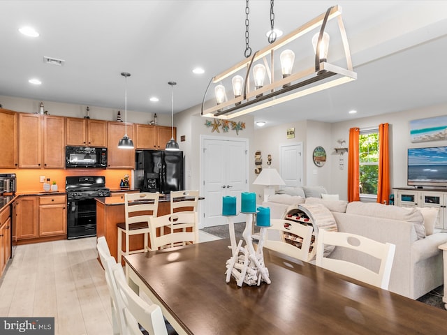 dining space featuring light hardwood / wood-style floors