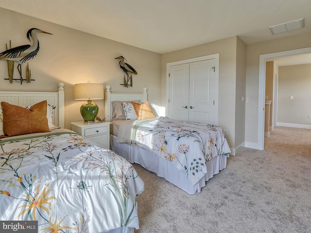 carpeted bedroom with a closet