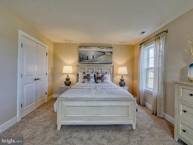 bedroom with light colored carpet