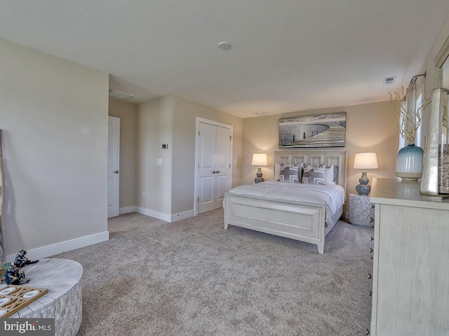 carpeted bedroom with a closet