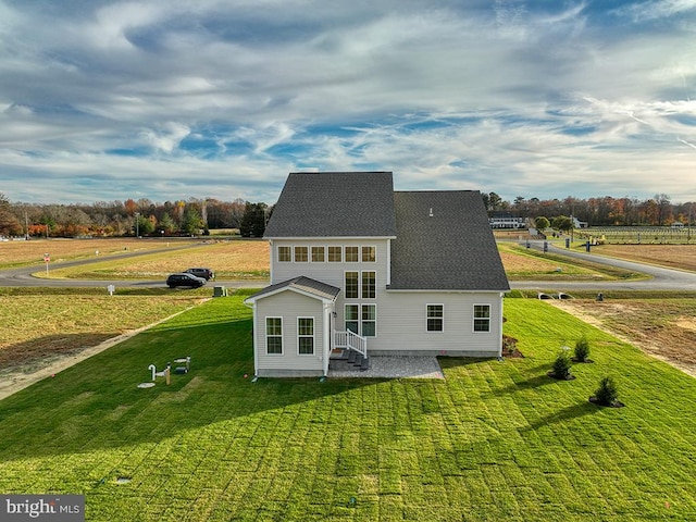 back of house with a yard