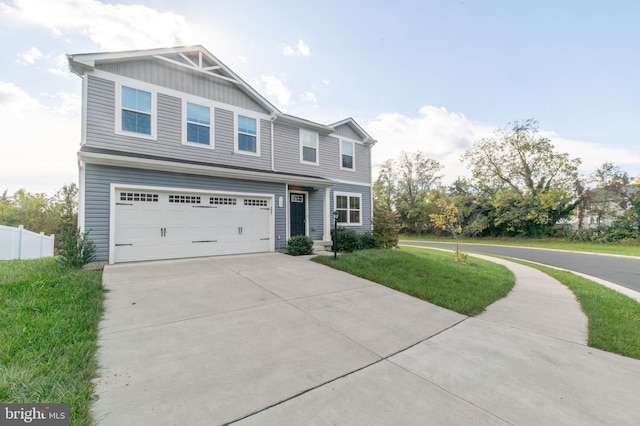 view of front of home featuring a garage and a front lawn