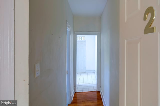 corridor featuring wood-type flooring