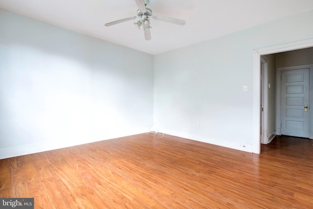 unfurnished room featuring ceiling fan and hardwood / wood-style floors