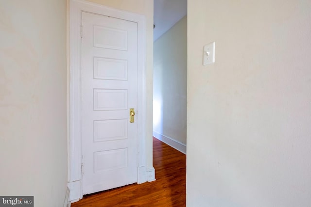 hallway featuring dark wood-type flooring