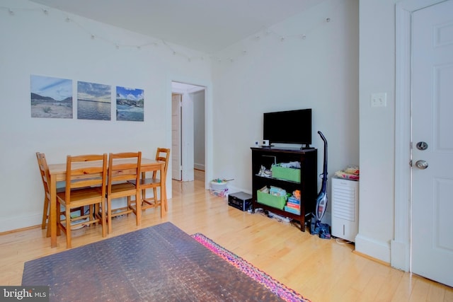 dining area with hardwood / wood-style flooring