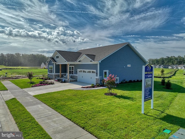 view of front facade featuring a front lawn and a garage