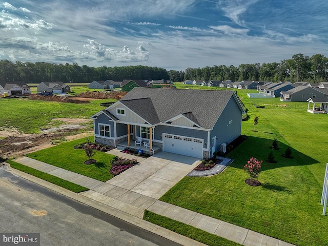 view of front of house with a front yard and a garage