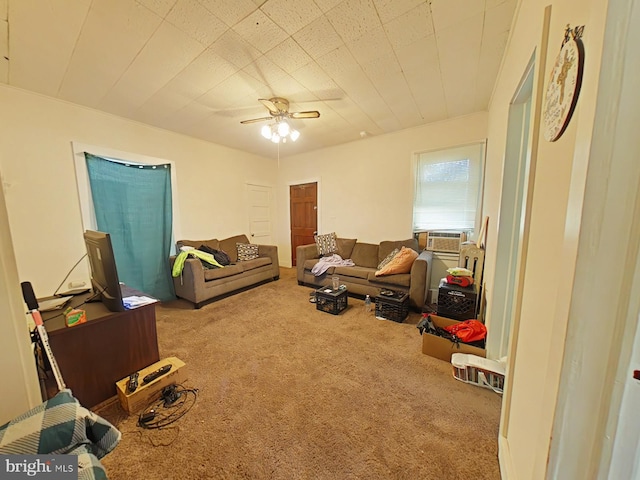 carpeted living room with cooling unit and ceiling fan