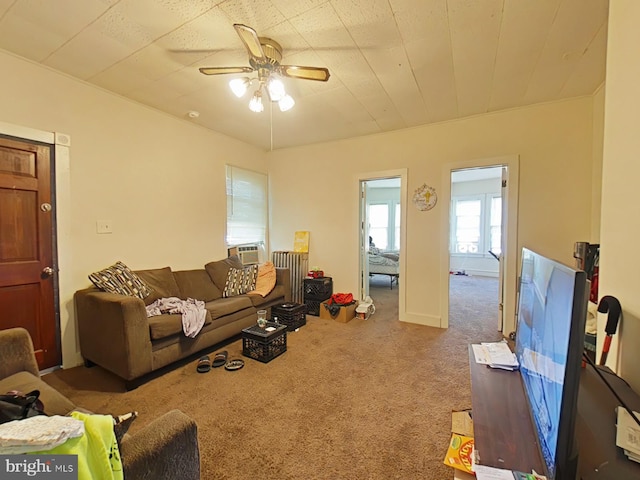 carpeted living room with cooling unit and ceiling fan