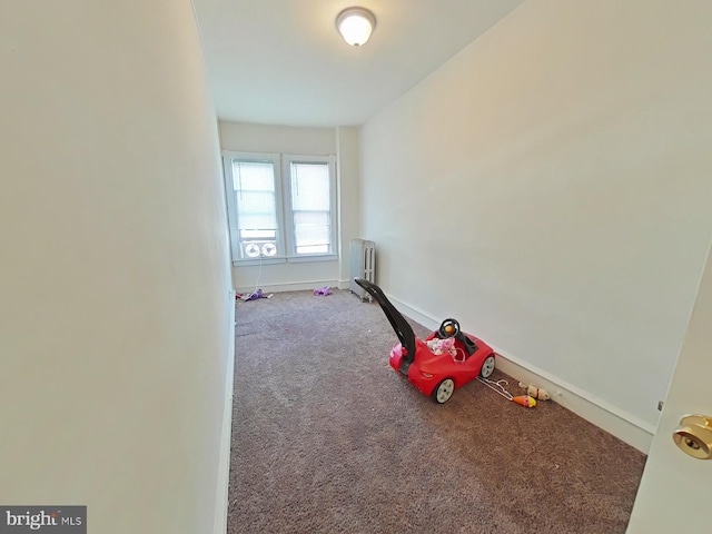 rec room with carpet flooring and radiator heating unit