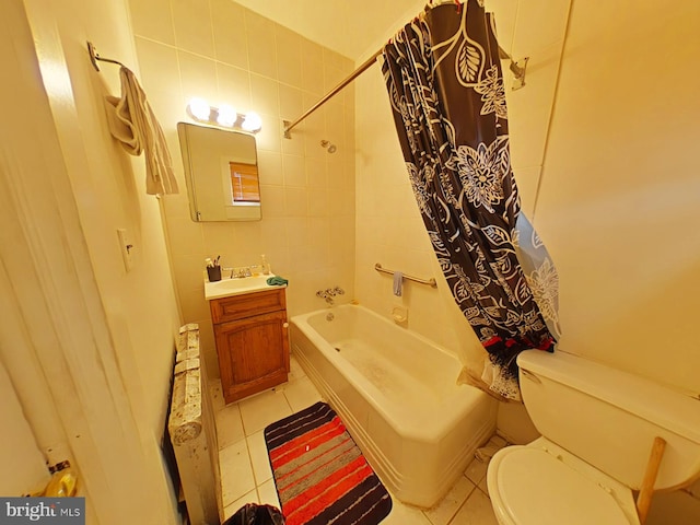 full bathroom featuring shower / bath combo, toilet, tile walls, tile patterned flooring, and vanity