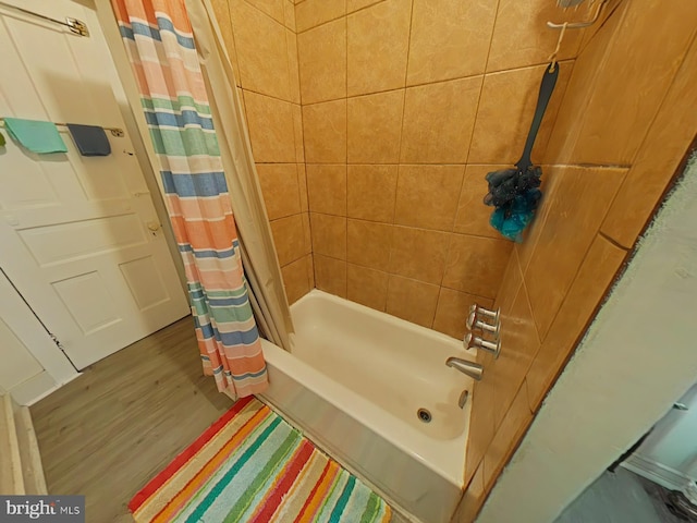 bathroom with wood-type flooring and shower / bath combination with curtain