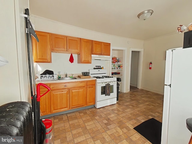 kitchen with sink and white appliances