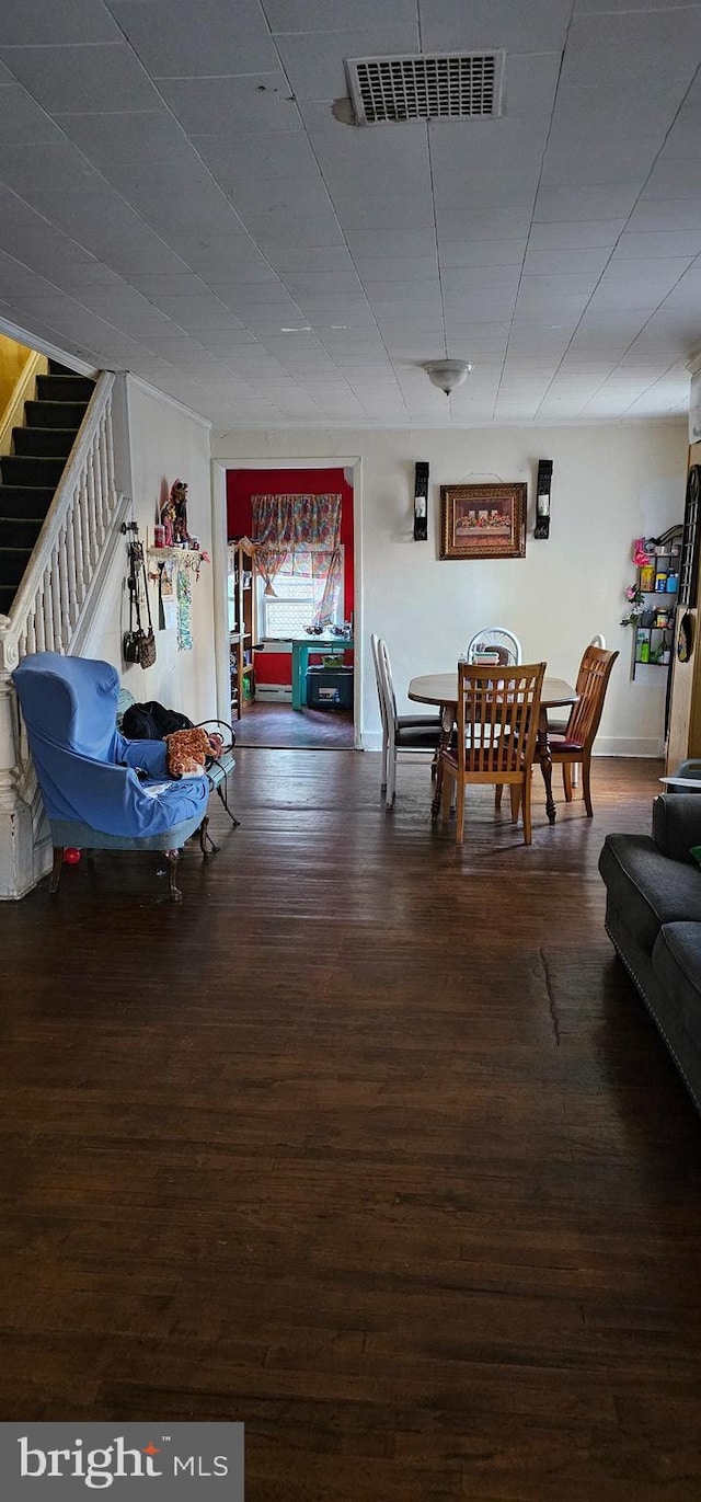 dining room with dark wood-type flooring