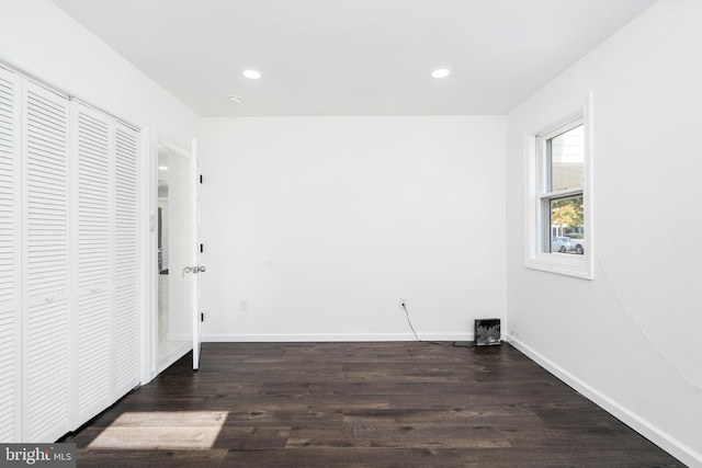 spare room featuring dark hardwood / wood-style floors