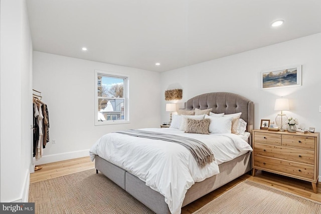 bedroom with hardwood / wood-style flooring