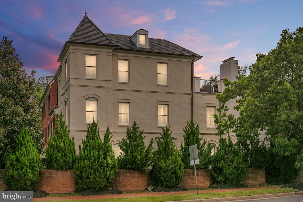 view of front of property with a balcony