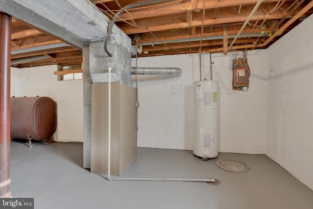 basement with electric water heater and electric panel