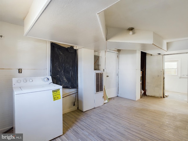 washroom featuring washer / clothes dryer and light wood-type flooring