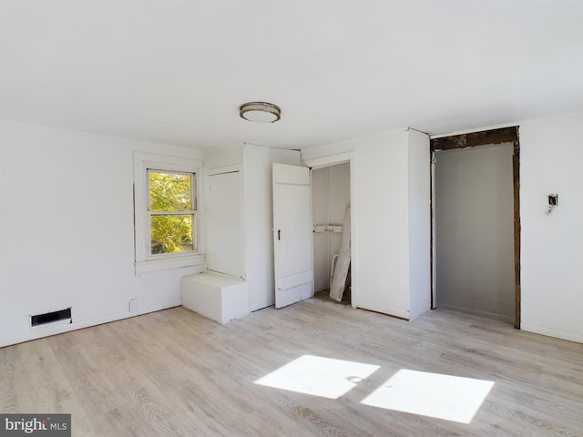 unfurnished bedroom featuring light hardwood / wood-style floors